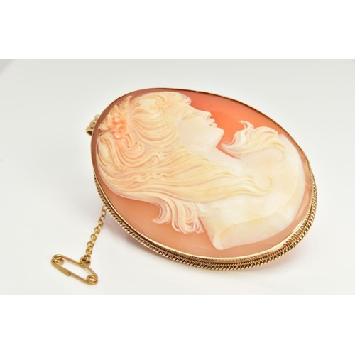 19 - A 9CT GOLD CAMEO BROOCH, oval carved shell depicting a lady in profile, bezel setting with a fine ro... 