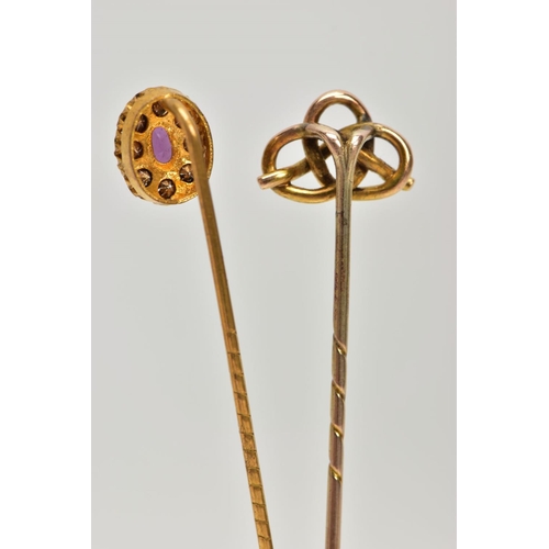 196 - TWO YELLOW METAL STICK PINS, the first detailed with an oval cluster, centring on an oval cut amethy... 