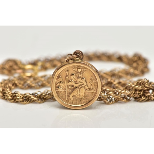 35 - A 9CT GOLD PENDANT AND CHAIN, a circular St Christopher pendant, suspended from a yellow gold Spiga ... 