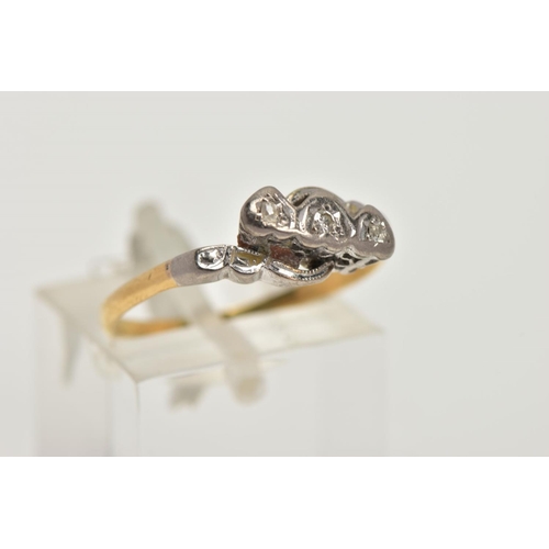 5 - A WHITE AND YELLOW METAL DIAMOND RING,  a single round brilliant cut diamond and two rose cut diamon... 