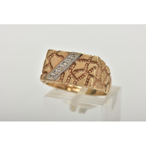 51 - A 9CT GOLD DIAMOND SIGNET RING, a yellow gold rectangular signet ring, textured detail with a diagon... 