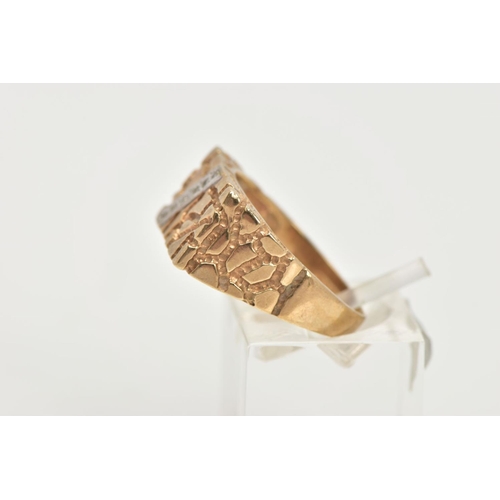 51 - A 9CT GOLD DIAMOND SIGNET RING, a yellow gold rectangular signet ring, textured detail with a diagon... 