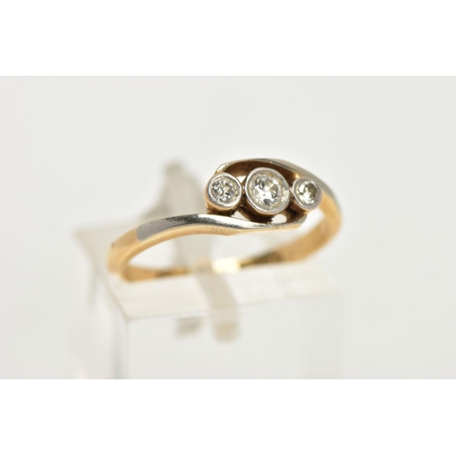 59 - A YELLOW METAL THREE STONE DIAMOND RING, three graduated old cut diamonds, milgrain bezel setting, e... 