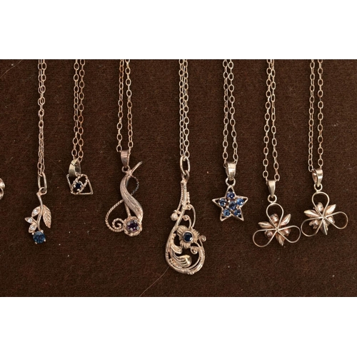 65 - A SELECTION OF WHITE METAL GEM SET NECKLACES, twelve white mental pendants suspended from white meta... 