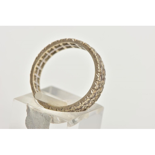 84 - A WHITE METAL FULL ETERNITY RING, wide band set with two rows of colourless spinels, approximate wid... 