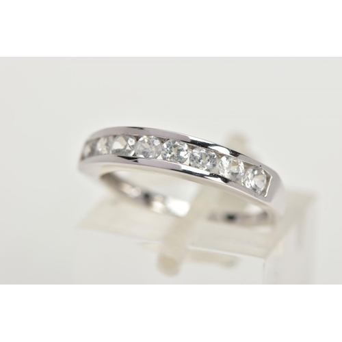 91 - A 9CT GOLD HALF ETERNITY RING, a white gold band ring, channel set with eight circular cut colourles... 