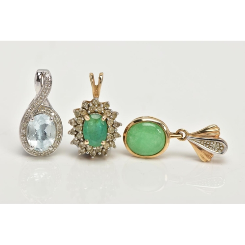 92 - TWO YELLOW METAL PENDANTS AND A WHITE METAL PENDANT, the first an oval cut emerald set with a cluste... 