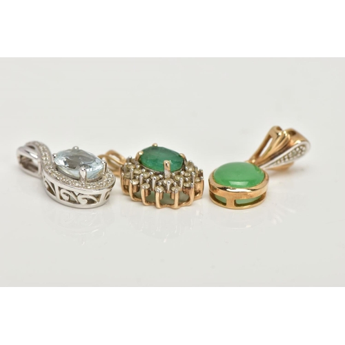 92 - TWO YELLOW METAL PENDANTS AND A WHITE METAL PENDANT, the first an oval cut emerald set with a cluste... 