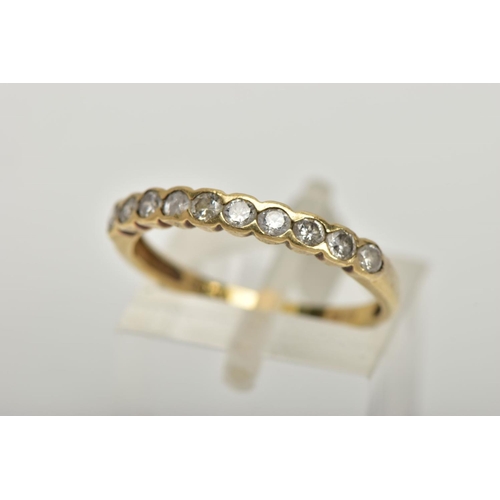 93 - AN 18CT GOLD HALF ETERNITY RING, a yellow gold semi bezel set half eternity ring, set with ten round... 