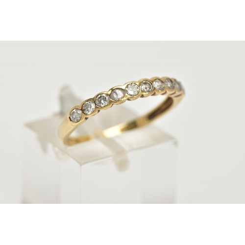 93 - AN 18CT GOLD HALF ETERNITY RING, a yellow gold semi bezel set half eternity ring, set with ten round... 