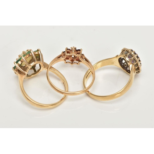 98 - THREE 9CT GOLD CLUSTER RINGS, the first an oval opal set with ten circular cut emeralds, set in yell... 