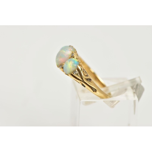 99 - AN OPAL AND DIAMOND RING, a yellow metal ring, set with three oval opals, accented with six rose cut... 