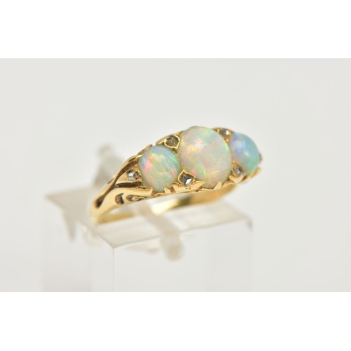 99 - AN OPAL AND DIAMOND RING, a yellow metal ring, set with three oval opals, accented with six rose cut... 