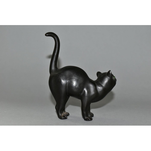 439 - A WEDGWOOD ETRURIA BLACK BASALT CAT WITH GREEN GLASS EYES DESIGNED BY ERNEST LIGHT, impressed marks,... 