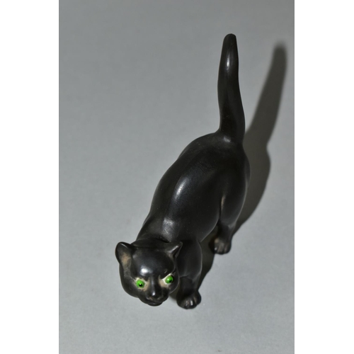 439 - A WEDGWOOD ETRURIA BLACK BASALT CAT WITH GREEN GLASS EYES DESIGNED BY ERNEST LIGHT, impressed marks,... 