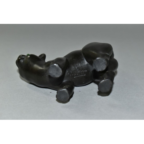 439 - A WEDGWOOD ETRURIA BLACK BASALT CAT WITH GREEN GLASS EYES DESIGNED BY ERNEST LIGHT, impressed marks,... 