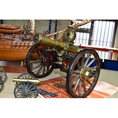 490 - A MODEL OF HMS BOUNTY AND MODEL CANNONS, a late twentieth century wooden model ship by Maquettes P. ... 