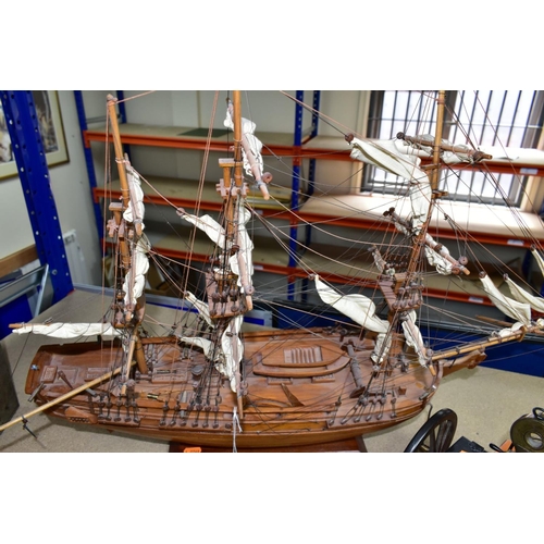 490 - A MODEL OF HMS BOUNTY AND MODEL CANNONS, a late twentieth century wooden model ship by Maquettes P. ... 