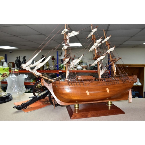 490 - A MODEL OF HMS BOUNTY AND MODEL CANNONS, a late twentieth century wooden model ship by Maquettes P. ... 