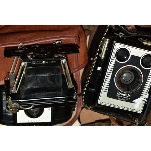 504 - A BOX OF CAMERAS AND PHOTOGRAPHIC EQUIPMENT, to include a Cosina CSM 35mm camera fitted with a Cosin... 