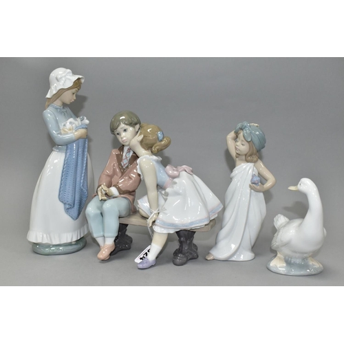 524 - TWO LLADRO FIGURES AND TWO NAO FIGURES, comprising 'Ten and Growing' No 7635, depicting girl kissing... 