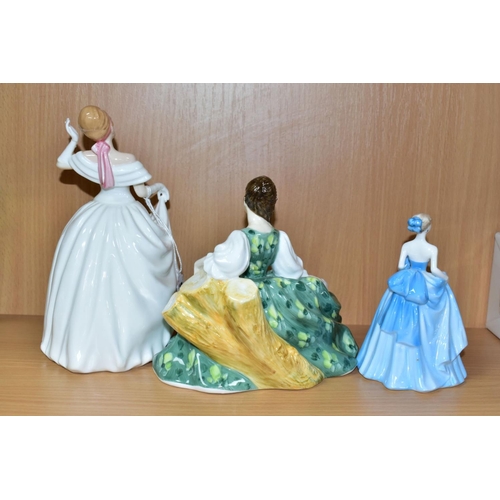 525 - TWO ROYAL DOULTON LADIES AND A COALPORT LADY, comprising 'Dawn' HN3600, glued repair to wrist of rai... 