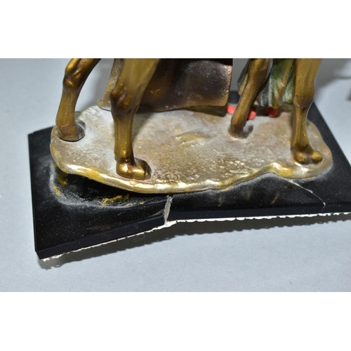 530 - A COLD PAINTED SPELTER TABLE LIGHTER IN THE FORM OF TWO FIGURES WITH A CAMEL, in the style of Bergma... 