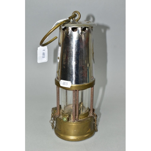 547 - A MINER'S SAFETY LAMP, of brass and chrome construction marked 'The Protector Lamp and Lighting Co. ... 