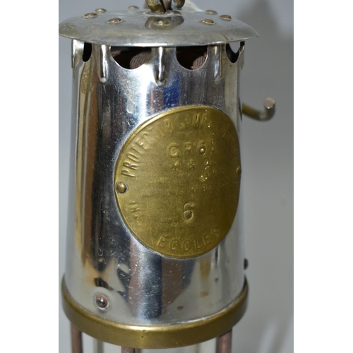 547 - A MINER'S SAFETY LAMP, of brass and chrome construction marked 'The Protector Lamp and Lighting Co. ... 