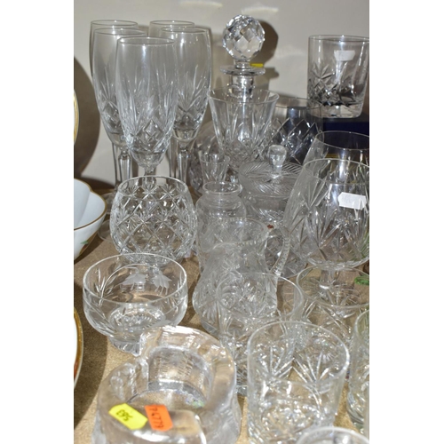 563 - A GROUP OF COLOURED AND CLEAR GLASSWARES, to include a cranberry glass jug with white rim detail and... 