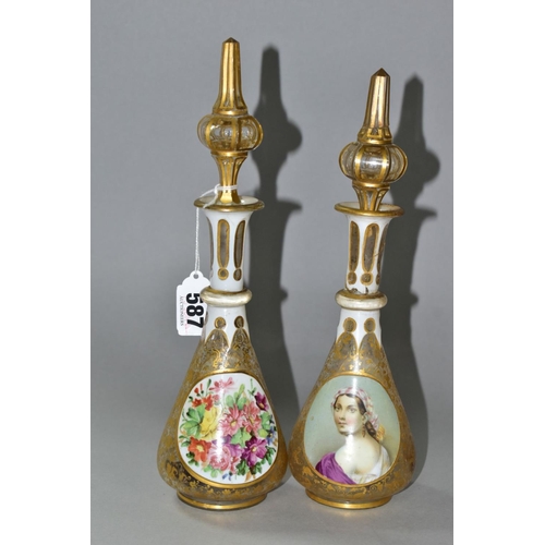 587 - A PAIR OF BOHEMIAN GLASS OVERLAY BOTTLES WITH STOPPERS, hand painted female  portraits to one side, ... 