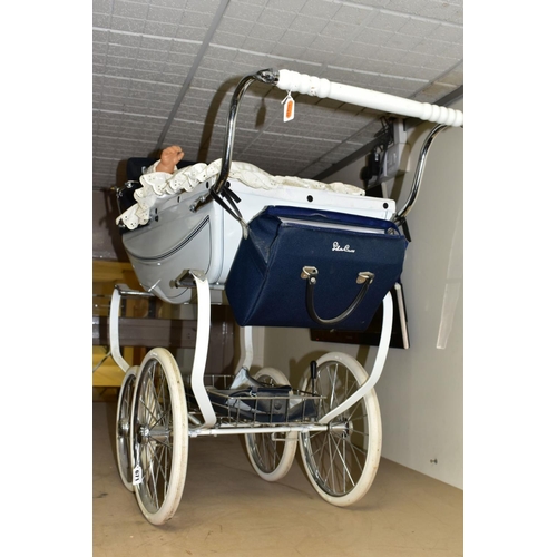 671 - A SILVER CROSS COACH BUILT DOLL'S PRAM IN WHITE WITH NAVY BANDING, with folding hood, removable cove... 