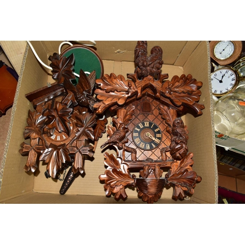 674 - TWO BOXES OF CLOCKS AND CLOCK PARTS, including two mid-20th century cuckoo clocks, the smaller one f... 