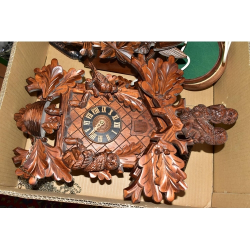 674 - TWO BOXES OF CLOCKS AND CLOCK PARTS, including two mid-20th century cuckoo clocks, the smaller one f... 