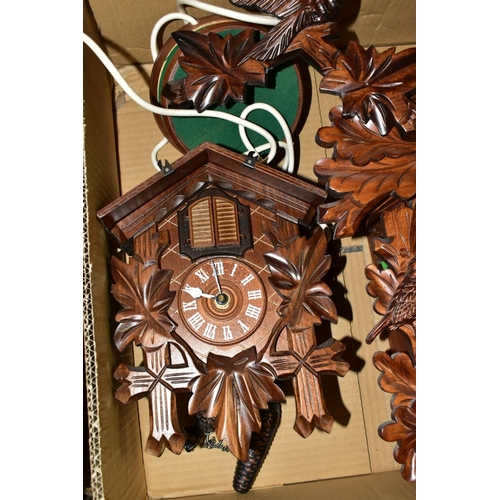 674 - TWO BOXES OF CLOCKS AND CLOCK PARTS, including two mid-20th century cuckoo clocks, the smaller one f... 