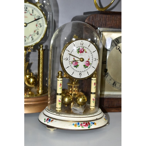 703 - FOUR CLOCKS, comprising an art nouveau style brass cased Ansonia mantel clock, the enamel dial set w... 