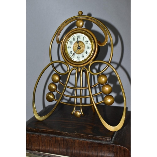 703 - FOUR CLOCKS, comprising an art nouveau style brass cased Ansonia mantel clock, the enamel dial set w... 