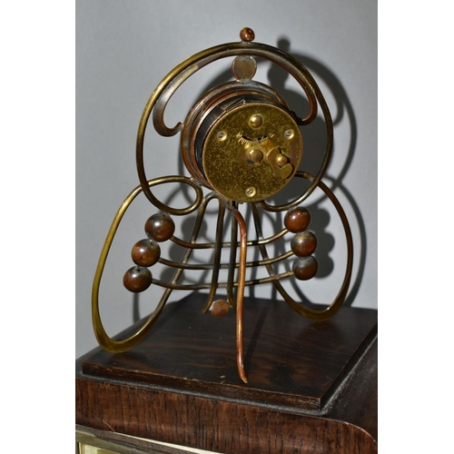 703 - FOUR CLOCKS, comprising an art nouveau style brass cased Ansonia mantel clock, the enamel dial set w... 