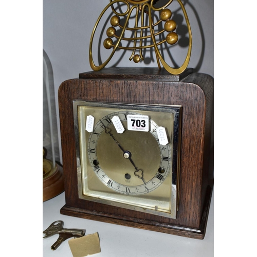 703 - FOUR CLOCKS, comprising an art nouveau style brass cased Ansonia mantel clock, the enamel dial set w... 