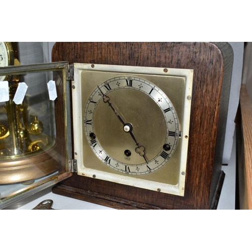 703 - FOUR CLOCKS, comprising an art nouveau style brass cased Ansonia mantel clock, the enamel dial set w... 