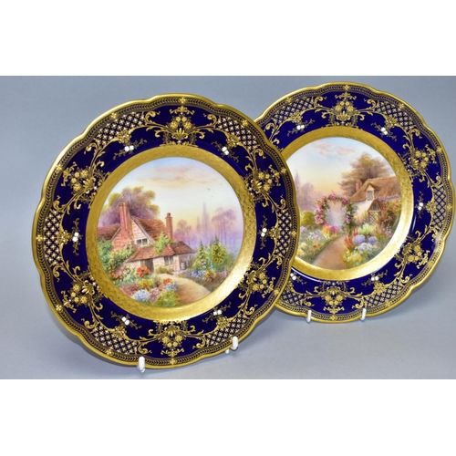 711 - TWO ROYAL WORCESTER CABINET PLATES, printed and painted cottage scenes to the centres, borderd by co... 