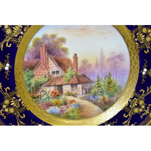 711 - TWO ROYAL WORCESTER CABINET PLATES, printed and painted cottage scenes to the centres, borderd by co... 