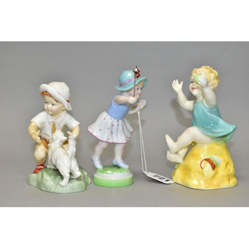 721 - THRE ROYAL WORCESTER FIGURES, comprising 'Snowy' 3457, a small boy with a white cat, modelled by Fre... 