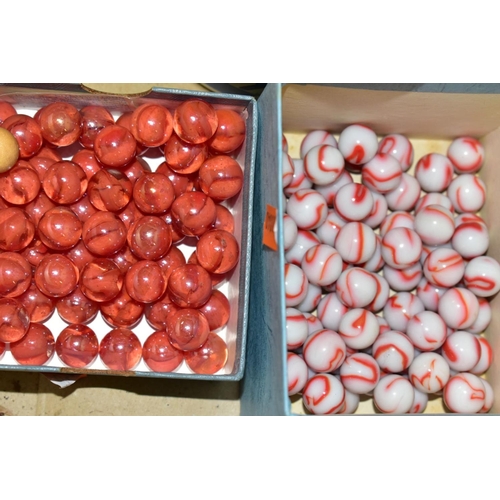 747 - A BOX OF MARBLES, including red and orange swirled marbles, white and red, red cats eye and coloured... 