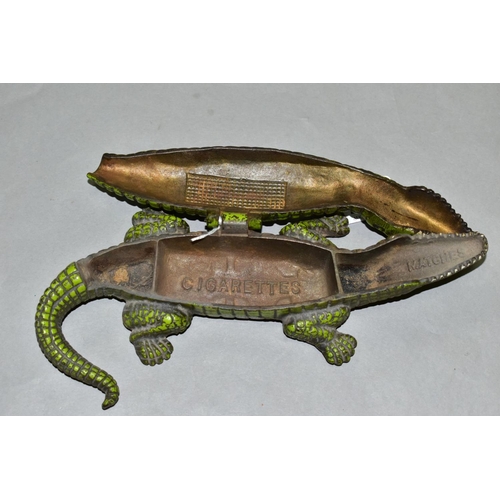 772 - A VINTAGE CAST IRON CIGARETTE/VESTA CASE, in the form of a crocodile, with hinged lid revealing inte... 