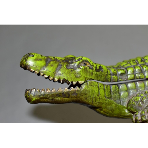 772 - A VINTAGE CAST IRON CIGARETTE/VESTA CASE, in the form of a crocodile, with hinged lid revealing inte... 