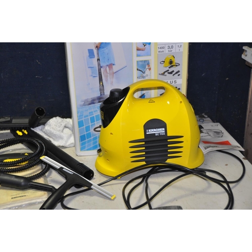 1269 - A KARCHER SC1122 STEAM CLEANER with a quantity of attachments and a Karcher Pressure Washer (case se... 