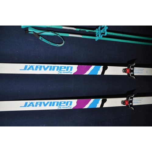 1371 - A PAIR OF J'A'RVINEN GUARTE 48 SKI'S along with a pair of Nova exel ski poles (4)