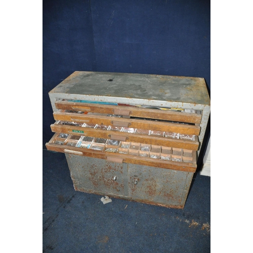 1385 - A VINTAGE STEEL ENGINEERS CHEST comprising seven wooden draws with dividers above steel double door ... 