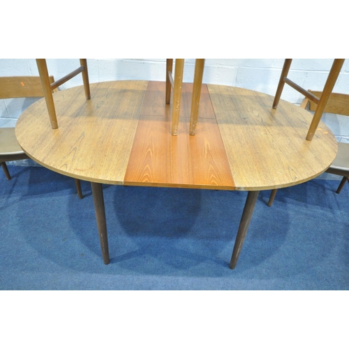 1402 - A MID CENTURY TEAK CIRCULAR EXTENDING DINING TABLE, with a single fold out leaf, extended leaf 150cm... 